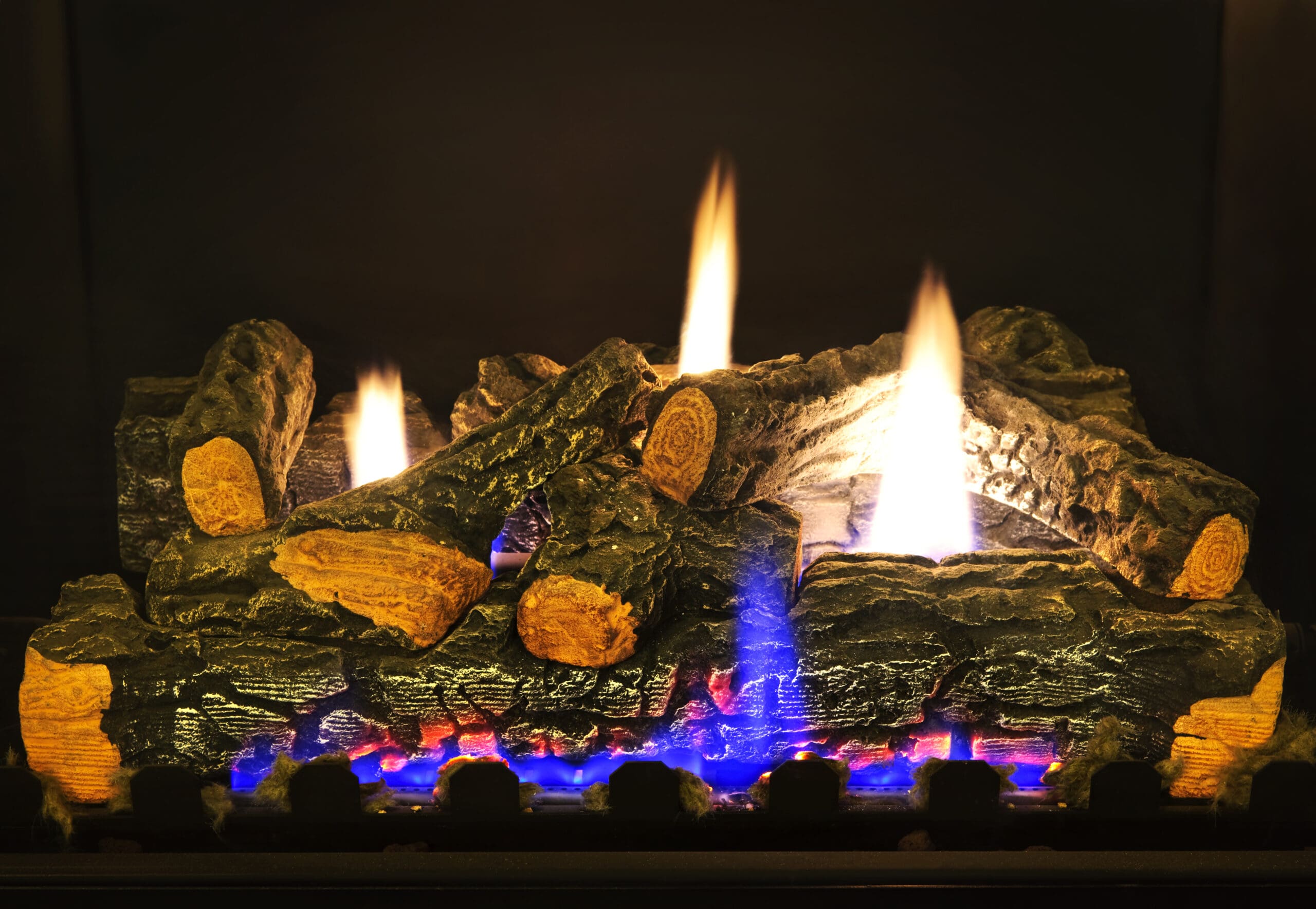 Close-up of logs on fire in gas fireplace