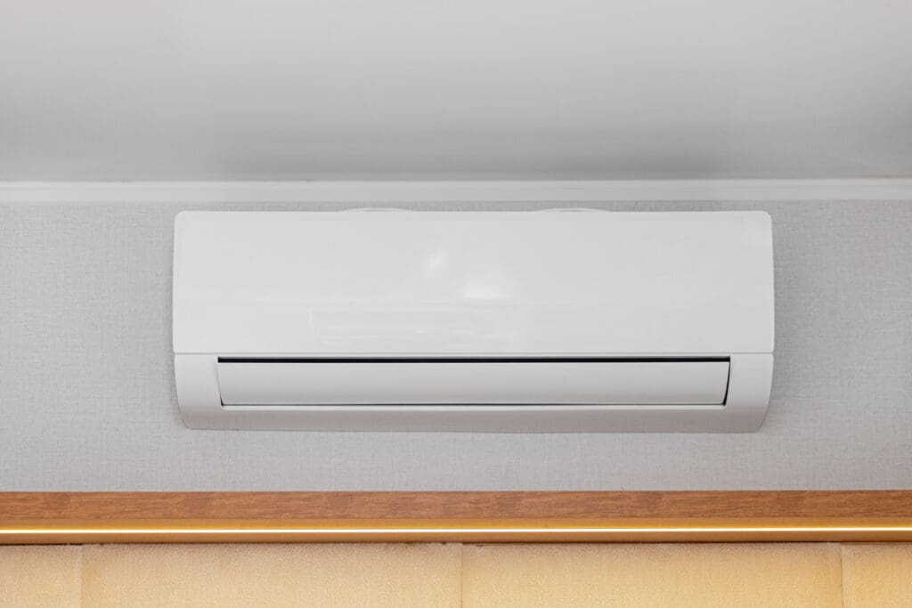 Ductless mini-split indoor unit mounted on a wall over a doorway