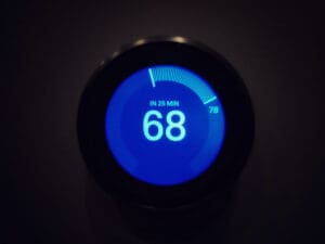 Close-up of a Nest thermostat set to 68 degrees