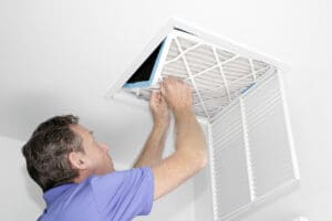 Man Removing Dirty Air Filter